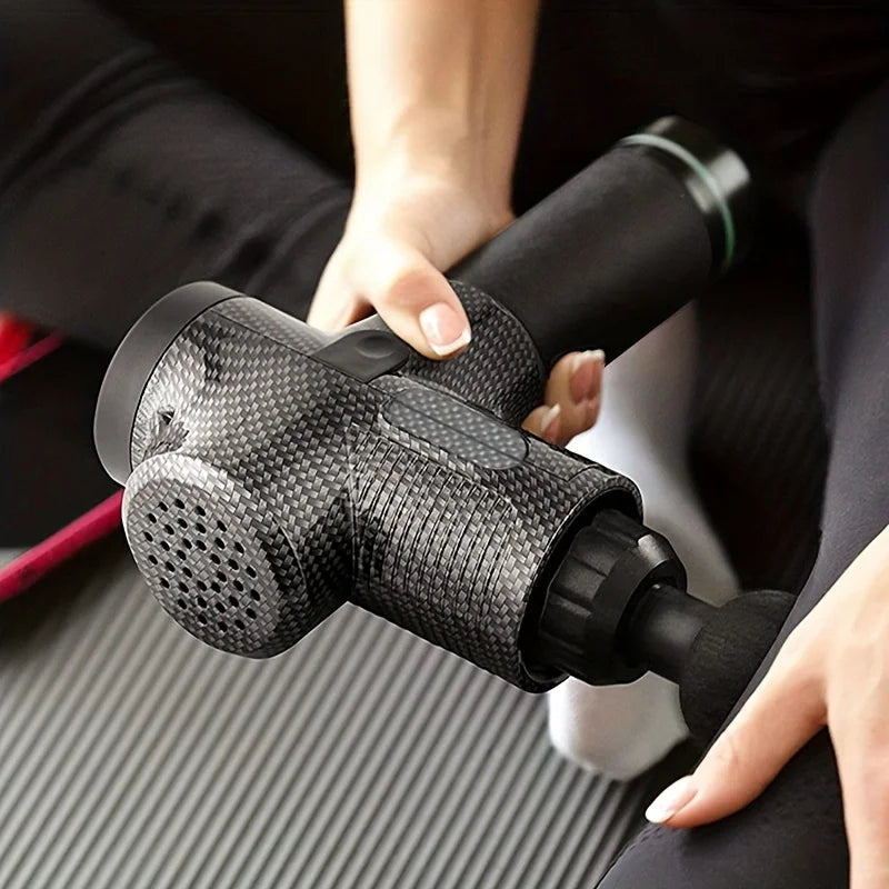 Massage gun in use on shoulder